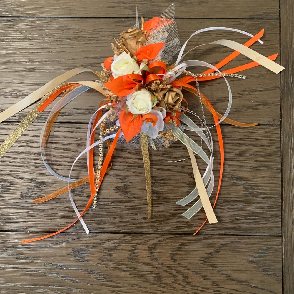 NEW Corsage. Orange, white, and gold in color.